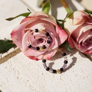 handmade black purple beaded hoop earrings