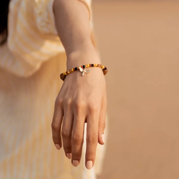 women’s handmade yellow orange brown bead charm bracelet