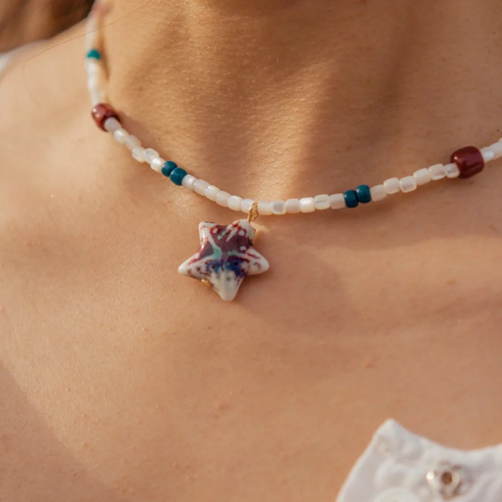 women’s handmade white bead necklace with pendant